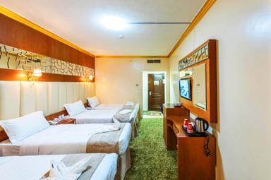 Spacious Hotel Bedroom With Seating Area